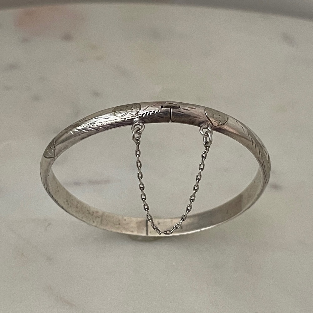 Vintage sterling engraved hearts.